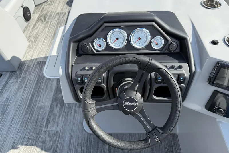 Slide: The Image of Steering console of 2026 Bentley Pontoons Legacy 223 Cruise XL with gauges and controls. - 19
