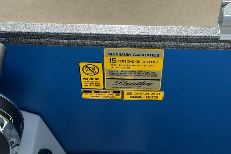 Slide: The Image of 2026 Bentley Pontoons Legacy 223 Cruise XL capacity warning label, blue background. - 22