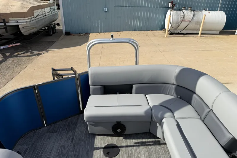 Slide: The Image of 2026 Bentley Pontoons Legacy 223 Cruise XL with gray seating and blue paneling. - 23