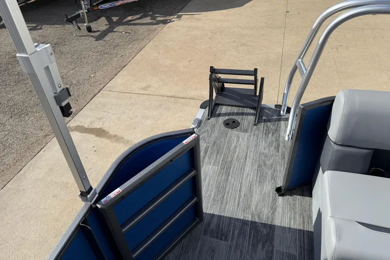 Slide: The Image of 2026 Bentley Pontoons Legacy 223 Cruise XL interior with seating and entry ladder. - 24
