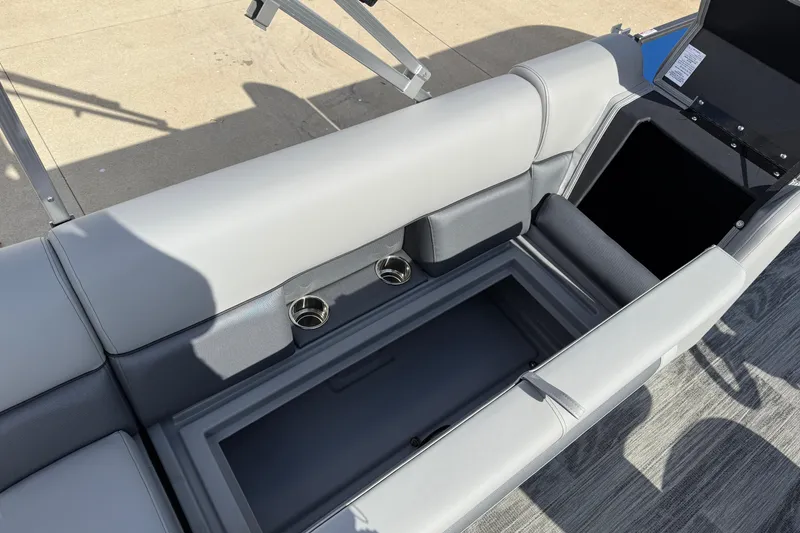 Slide: The Image of 2026 Bentley Pontoons Legacy 223 Cruise XL interior seating with storage and cup holders. - 26