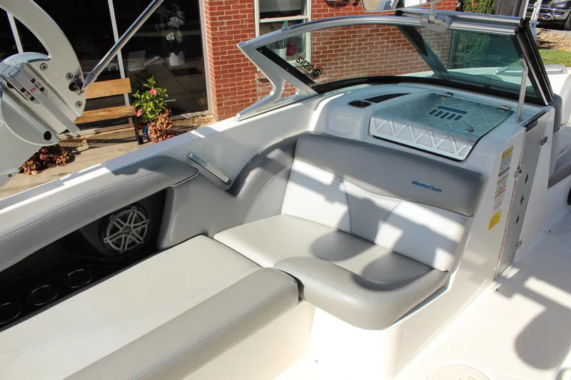 Slide: The Image of 2016 MasterCraft X30 boat interior with gray seating and modern design. - 9