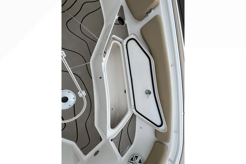 Slide: The Image of 2016 Tidewater 280 CC Adventure boat interior with open storage compartment. - 10