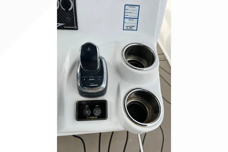 Slide: The Image of Control panel of 2016 Tidewater 280 CC Adventure boat with Yamaha controls and cup holders. - 19
