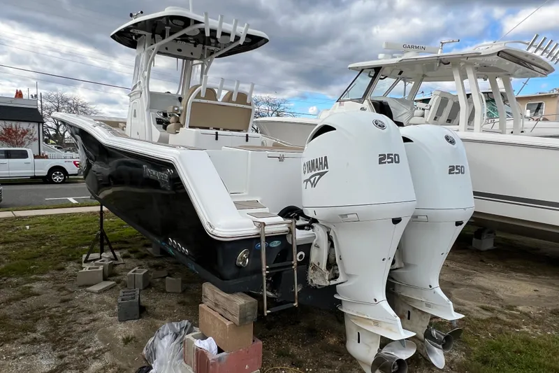 Slide: The Image of 2016 Tidewater 280 CC Adventure boat with twin Yamaha 250 engines on display. - 2