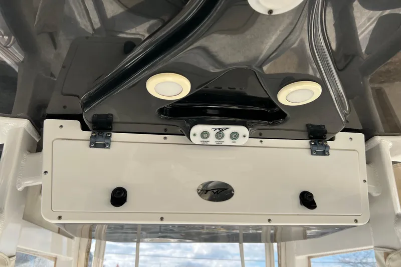 Slide: The Image of 2016 Tidewater 280 CC Adventure boat console with controls and lighting. - 20