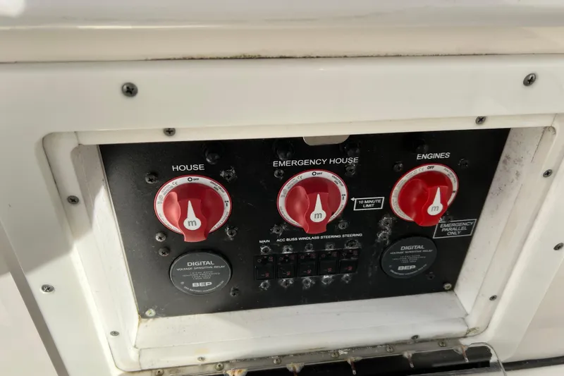 Slide: The Image of Control panel of a 2016 Tidewater 280 CC Adventure boat with switches and dials. - 22