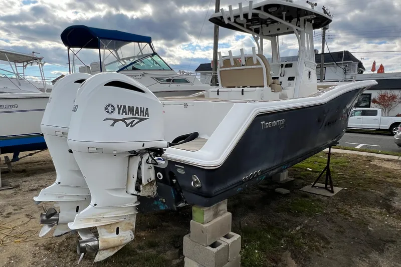 Slide: The Image of 2016 Tidewater 280 CC Adventure boat with twin Yamaha engines on display. - 3