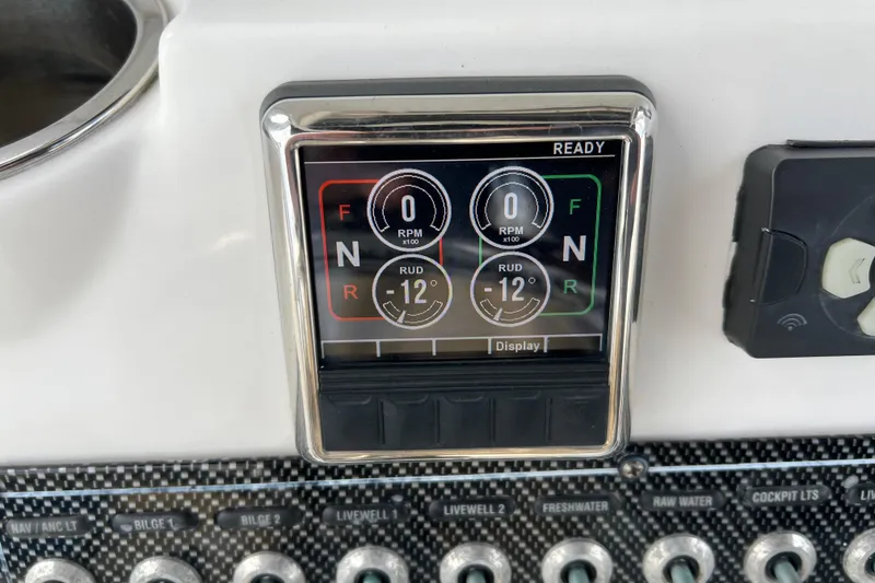 Slide: The Image of Dashboard display of a 2016 Tidewater 280 CC Adventure boat, showing RPM and rudder angle. - 32