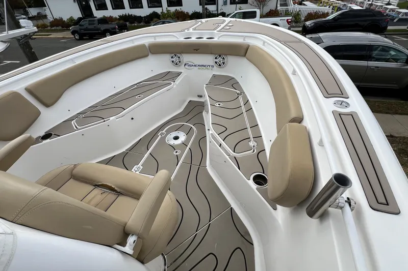 Slide: The Image of 2016 Tidewater 280 CC Adventure boat interior with beige seating and non-slip flooring. - 6