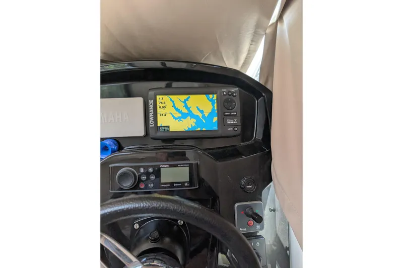 Slide: The Image of Dashboard of 2016 Jeanneau Merry Fisher 795 with navigation equipment. - 10