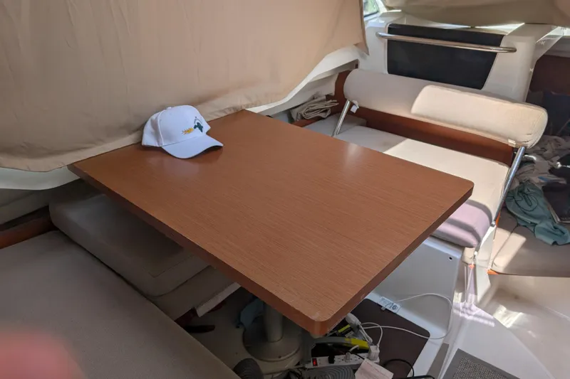 Slide: The Image of Interior of 2016 Jeanneau Merry Fisher 795 with wooden table and cap. - 5