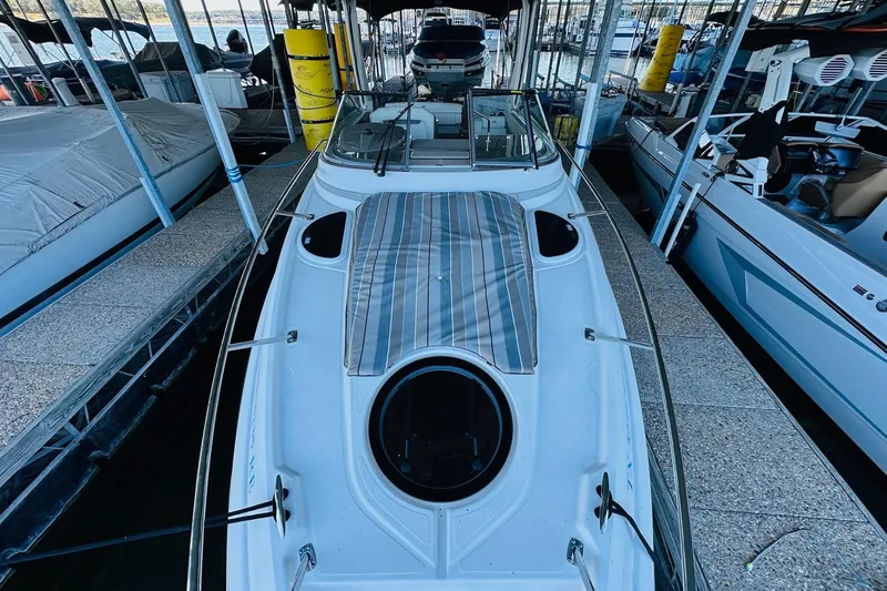 Slide: The Image of 2017 Regal 28 Express boat docked in a marina, top view. - 13