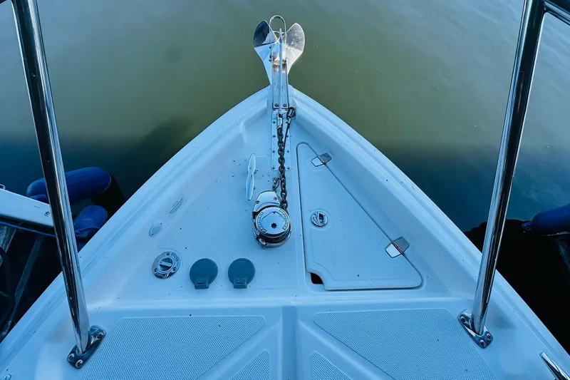 Slide: The Image of Bow of 2017 Regal 28 Express boat with anchor and railing. - 14