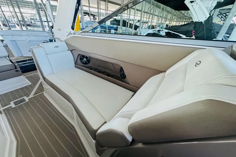 Slide: The Image of 2017 Regal 28 Express boat interior with beige seating and modern design. - 18