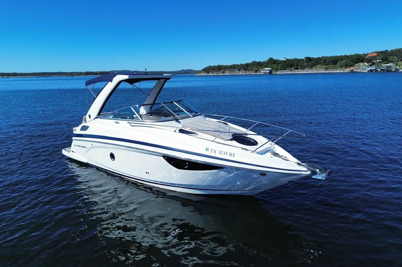 Slide: The Image of 2017 Regal 28 Express boat on calm blue water under clear sky. - 2