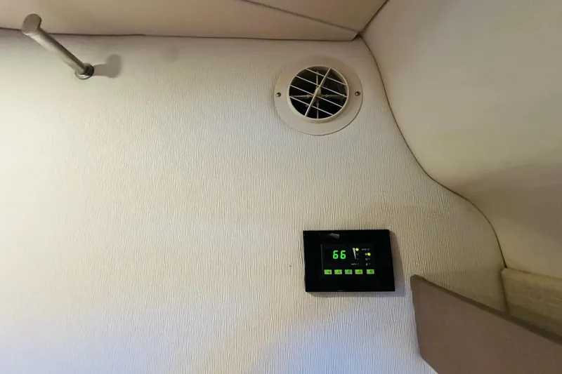 Slide: The Image of Thermostat and vent inside 2017 Regal 28 Express boat cabin. - 33
