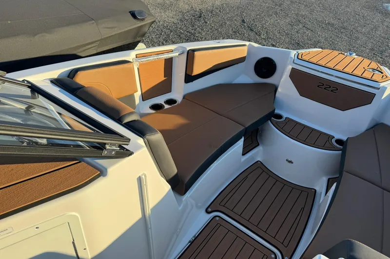 Slide: The Image of 2026 Yamaha Boats 222SD interior with brown seating and sleek design. - 10