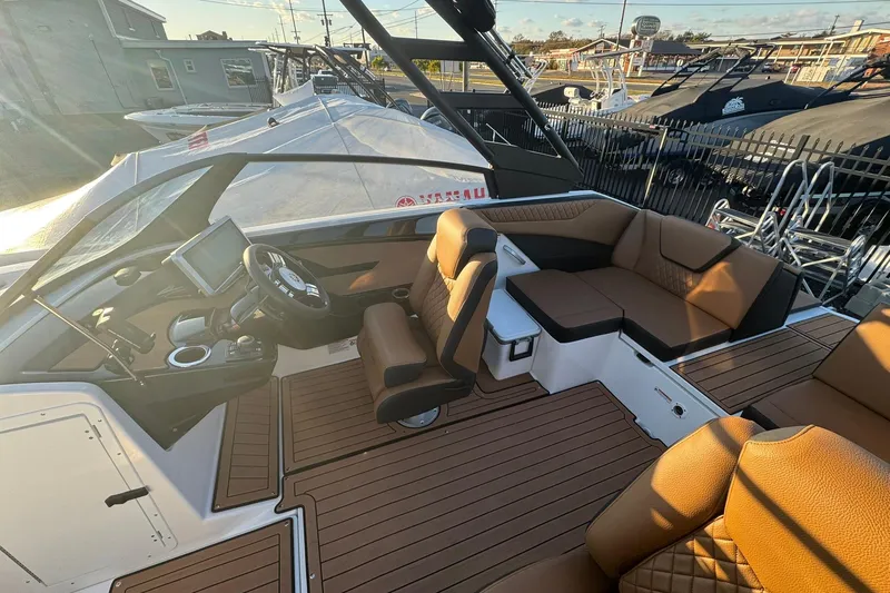 Slide: The Image of Manufacturer Provided Image: 2026 Yamaha Boats 222SD cruising at sunset on tranquil waters. - 12