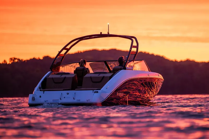 Slide: The Image of 2026 Yamaha Boats 222SD interior with brown seating and modern dashboard. - 13