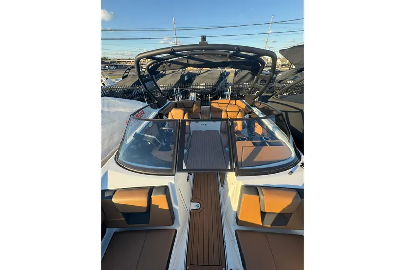 Slide: The Image of Manufacturer Provided Image: 2026 Yamaha Boats 222SD cruising at sunset on a serene lake. - 14