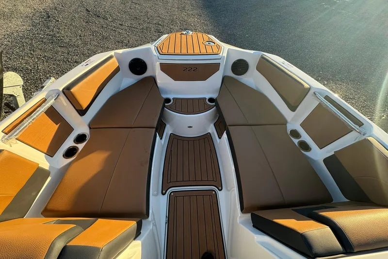 Slide: The Image of 2026 Yamaha Boats 222SD interior with brown seating and sleek design. - 4