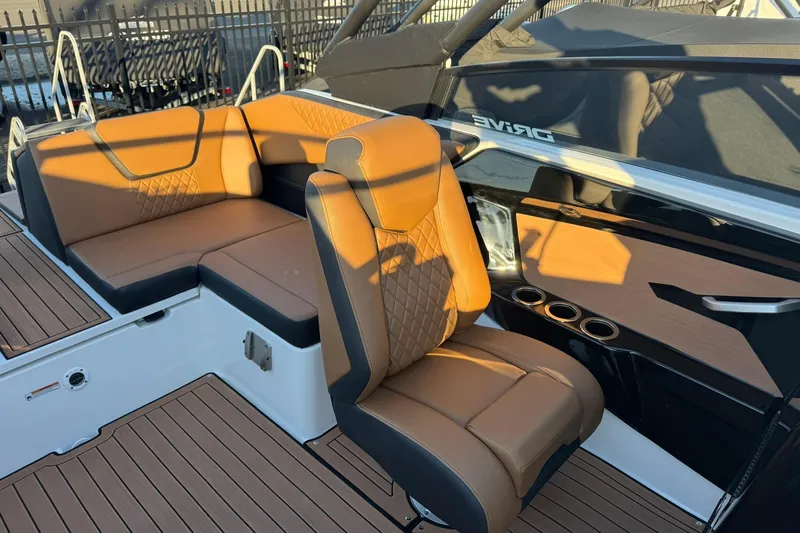 Slide: The Image of 2026 Yamaha Boats 222SD interior with tan seating and sleek design. - 6