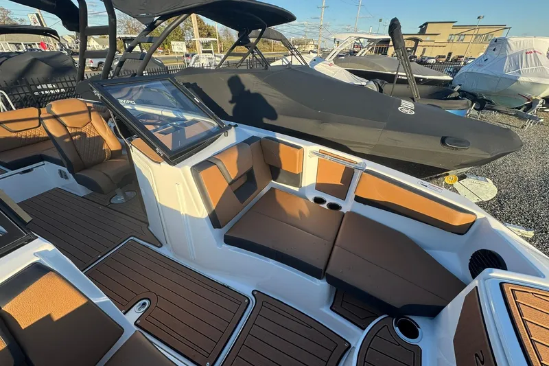 Slide: The Image of 2026 Yamaha Boats 222SD interior with brown seating and sleek design. - 9