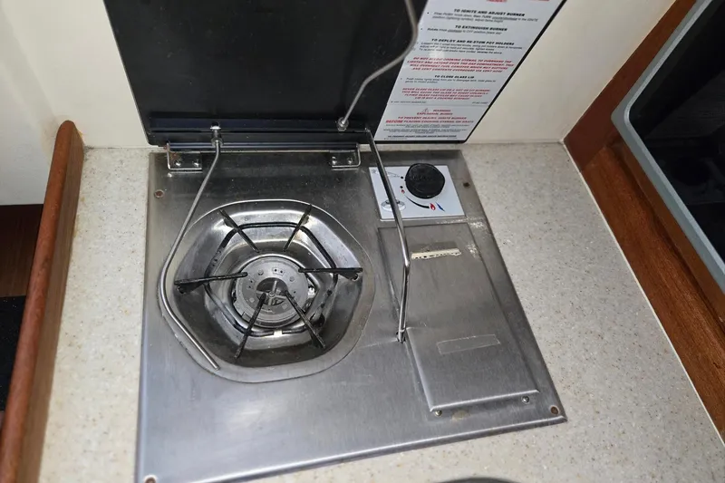 Slide: The Image of Stainless steel stove on 1998 Mainship Pilot 30 boat galley countertop. - 67