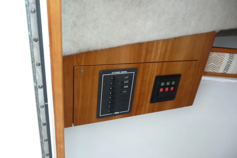 Slide: The Image of 2016 Albemarle 25 Express boat interior with AC power control panel. - 20