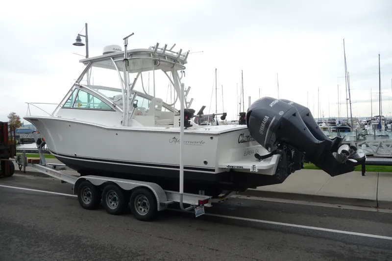 Slide: The Image of 2016 Albemarle 25 Express boat on trailer, dockside with Yamaha outboard engine. - 3