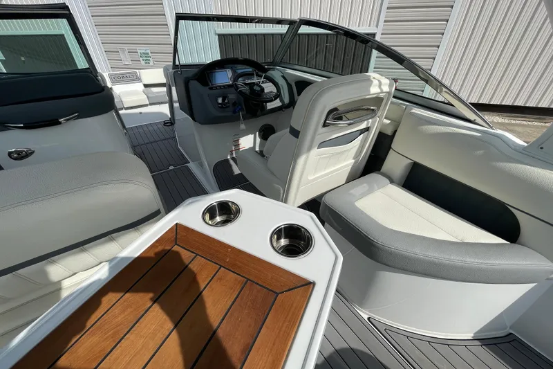 Slide: The Image of 2018 Cobalt 25SC boat interior with sleek seating and modern dashboard. - 11