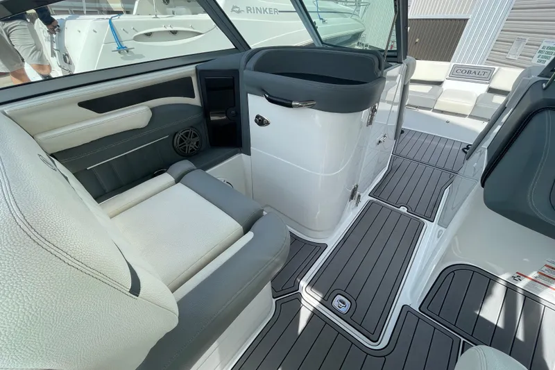 Slide: The Image of 2018 Cobalt 25SC boat interior with sleek seating and modern design. - 12