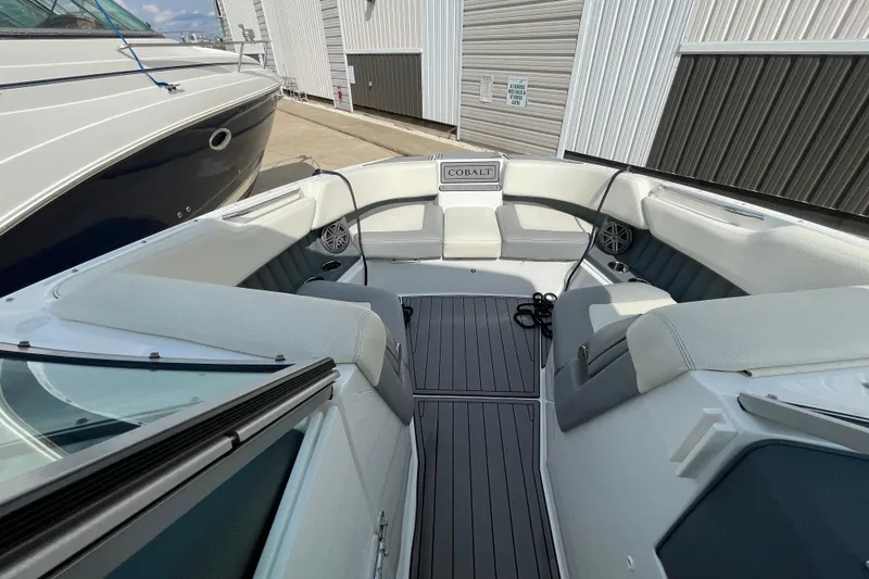 Slide: The Image of 2018 Cobalt 25SC boat interior with spacious seating and sleek design. - 14