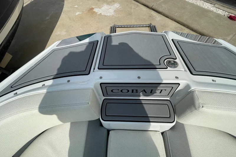 Slide: The Image of 2018 Cobalt 25SC boat deck with sleek design and branding. - 15