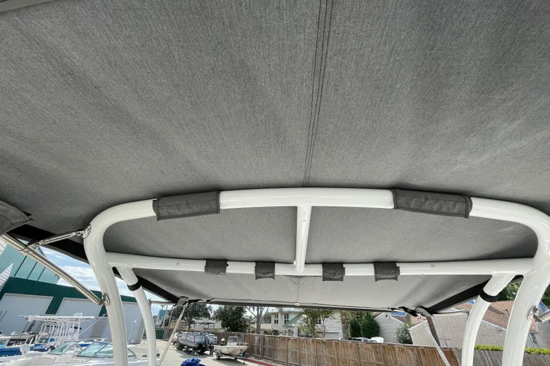 Slide: The Image of 2018 Cobalt 25SC boat canopy with sturdy frame and gray fabric. - 17