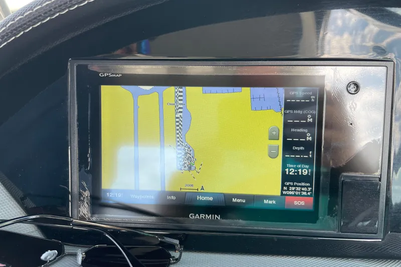 Slide: The Image of Garmin GPS display on 2018 Cobalt 25SC boat, showing navigation map and coordinates. - 26
