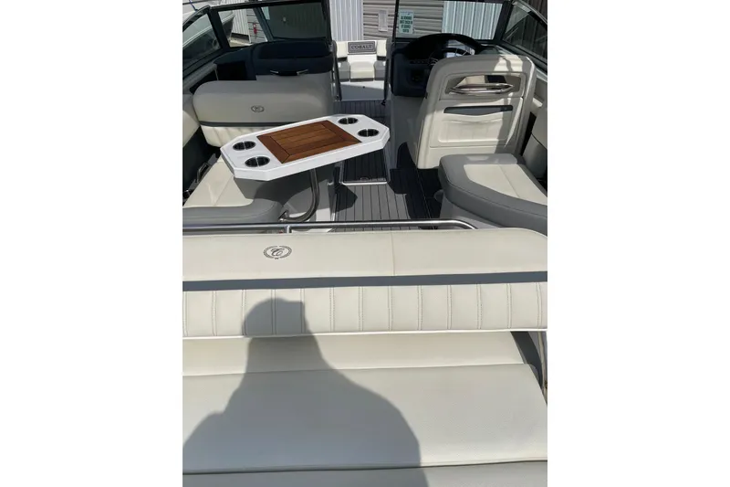 Slide: The Image of 2018 Cobalt 25SC boat interior with white seating and a central table. - 7