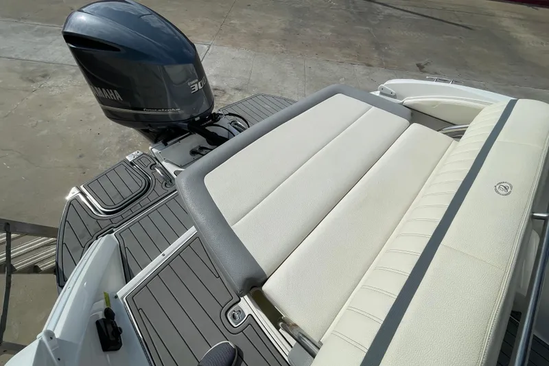 Slide: The Image of 2018 Cobalt 25SC boat with Yamaha 300 engine and cushioned seating. - 9