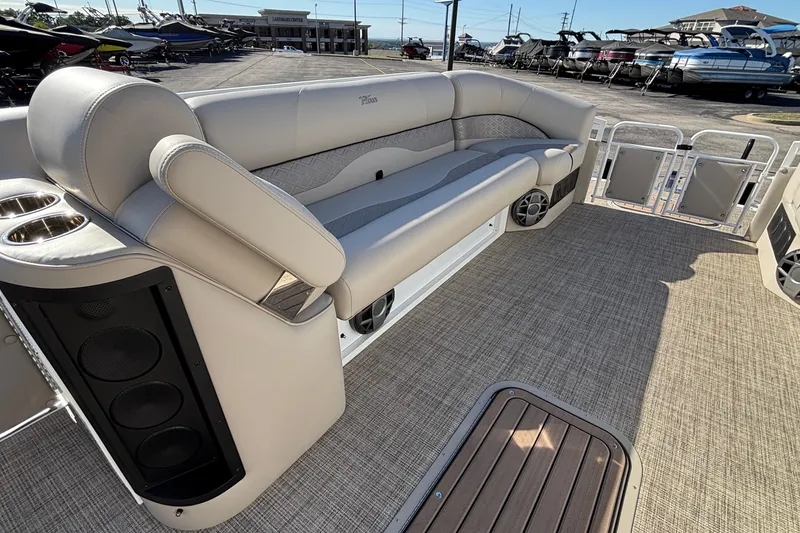 Slide: The Image of Luxury seating on 2026 JC Neptoon 25TT Sport pontoon boat, featuring premium upholstery and speakers. - 17