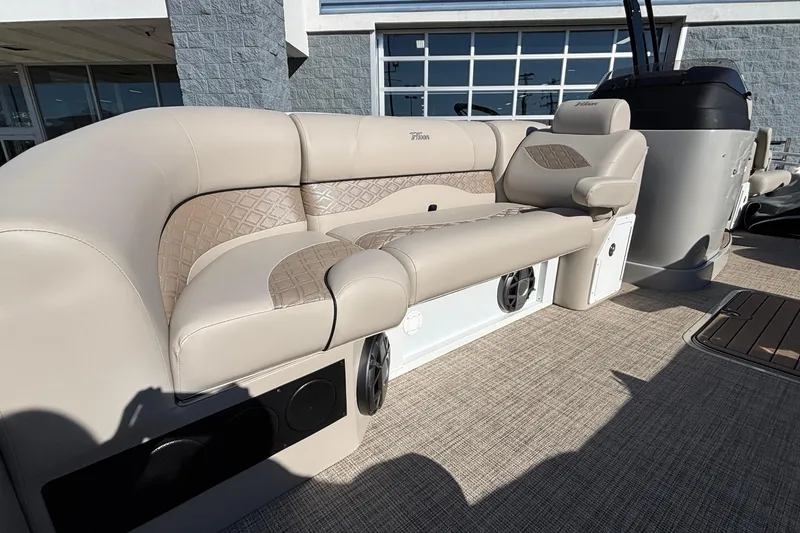 Slide: The Image of Luxurious seating on 2026 JC Neptoon 25TT Sport pontoon boat, featuring beige upholstery and speakers. - 20