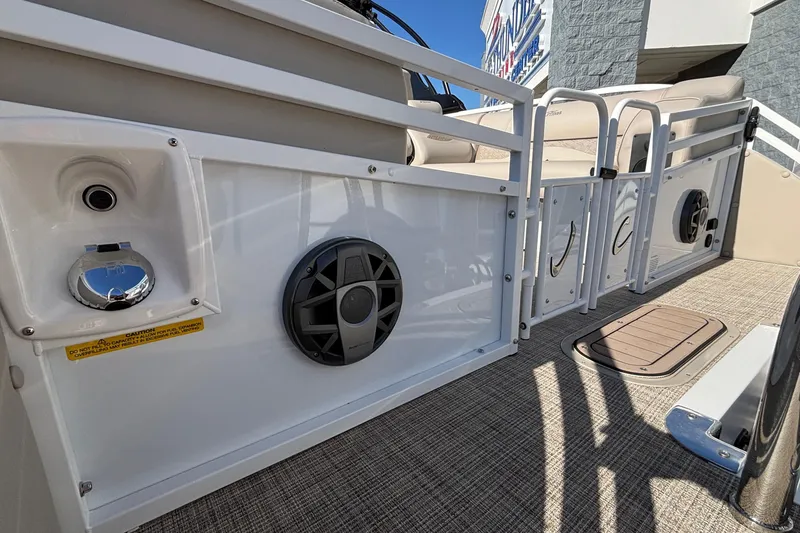 Slide: The Image of 2026 JC Neptoon 25TT Sport boat interior with speakers and seating area. - 5