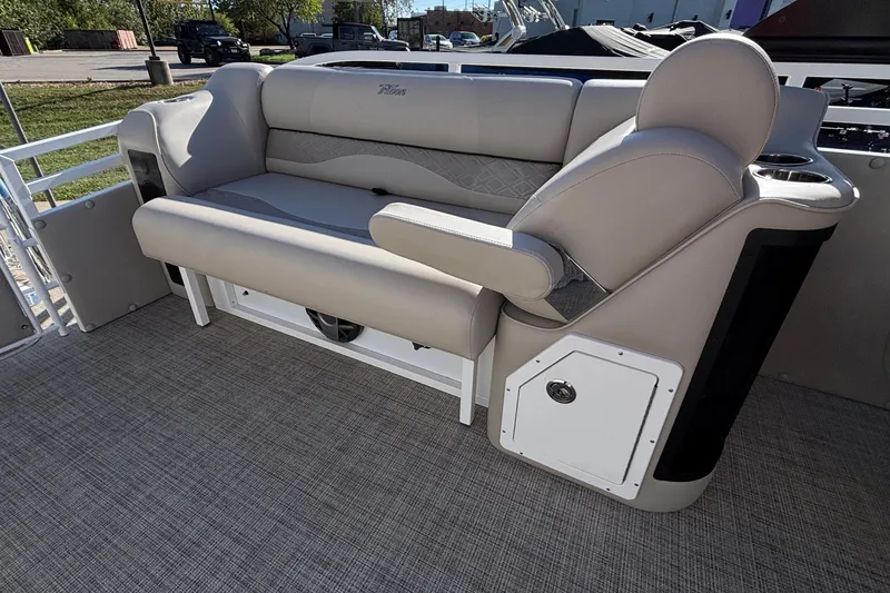 Slide: The Image of Luxurious seating on 2026 JC Neptoon 25TT Sport pontoon boat, featuring beige upholstery. - 11