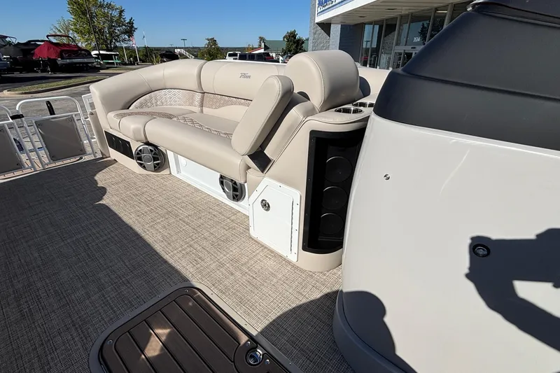 Slide: The Image of Luxury seating on 2026 JC Neptoon 25TT Sport pontoon boat, featuring premium upholstery and speakers. - 18