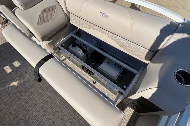 Slide: The Image of 2026 JC Neptoon 25TT Sport boat interior with open storage compartment. - 26