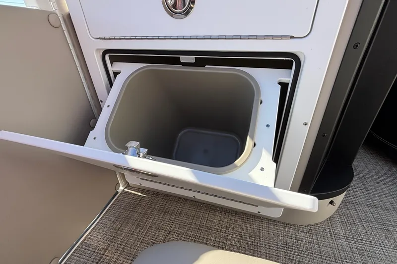 Slide: The Image of Open storage compartment on 2026 JC Neptoon 25TT Sport boat, featuring sleek design. - 28