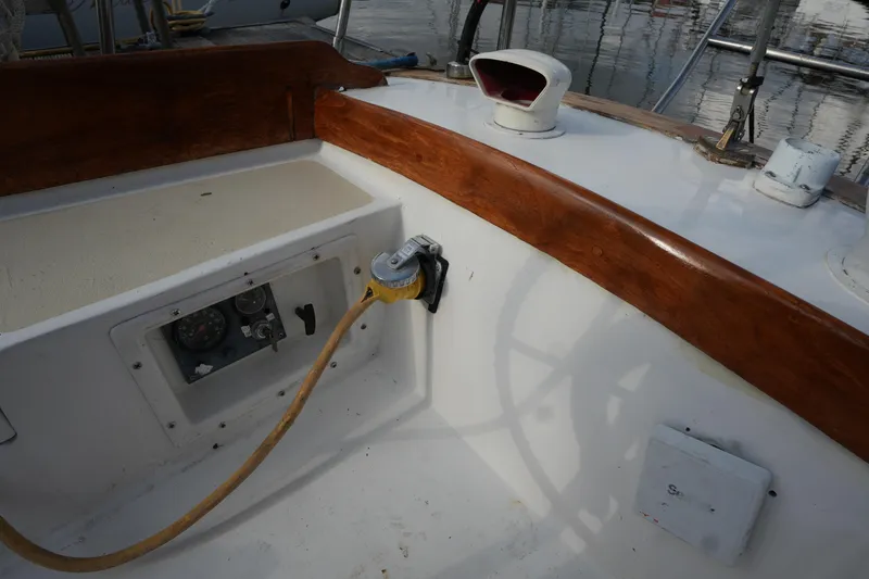 Slide: The Image of Cockpit of 1983 Cape Dory 30c sailboat with wooden trim and electrical connection. - 23