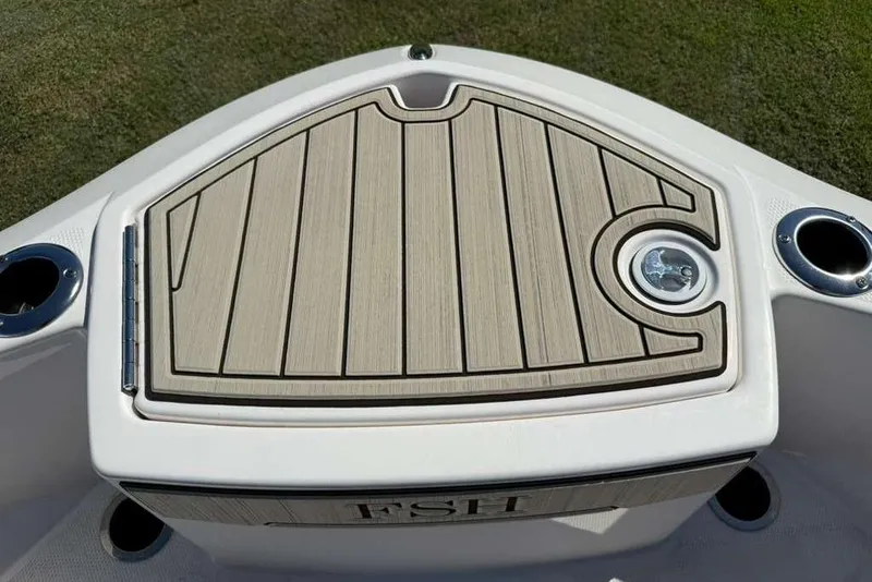 Slide: The Image of 2023 Yamaha Boats 255 FSH Sport E bow with teak-style decking and cup holders. - 14