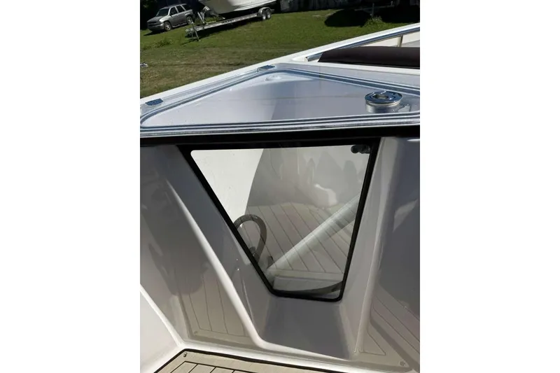 Slide: The Image of 2023 Yamaha Boats 255 FSH Sport E, interior detail with sleek design and modern features. - 17