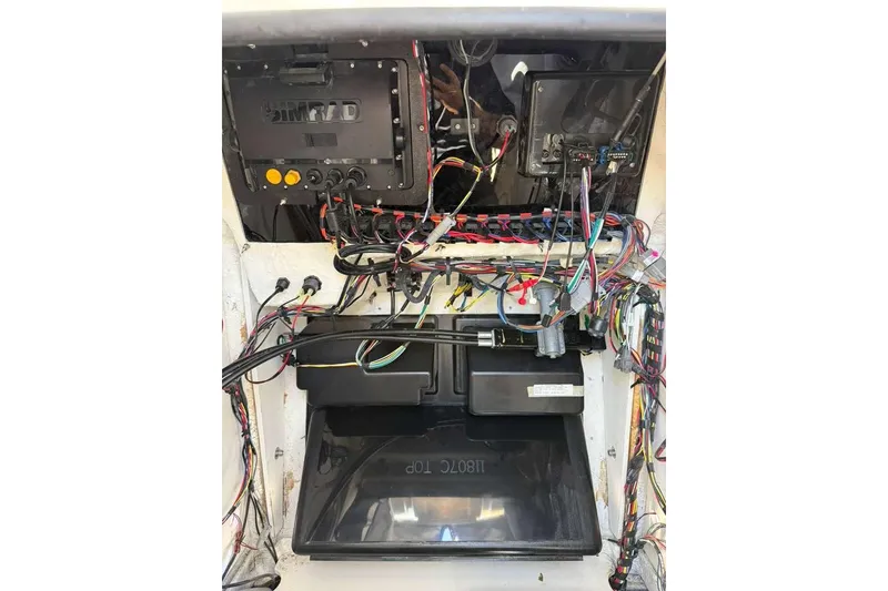 Slide: The Image of 2023 Yamaha Boats 255 FSH Sport E wiring and control panel interior view. - 30